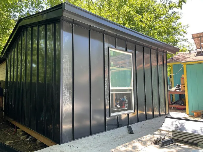 Black standing seam metal wall panels for Metal Roof Installation in Westbury