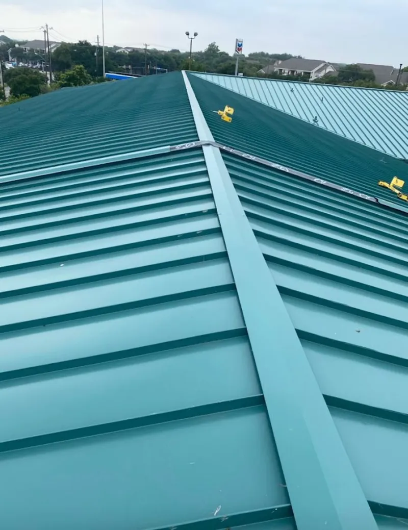 Green commercial metal roof ridge and valley for Metal Roof Repair in Westbury